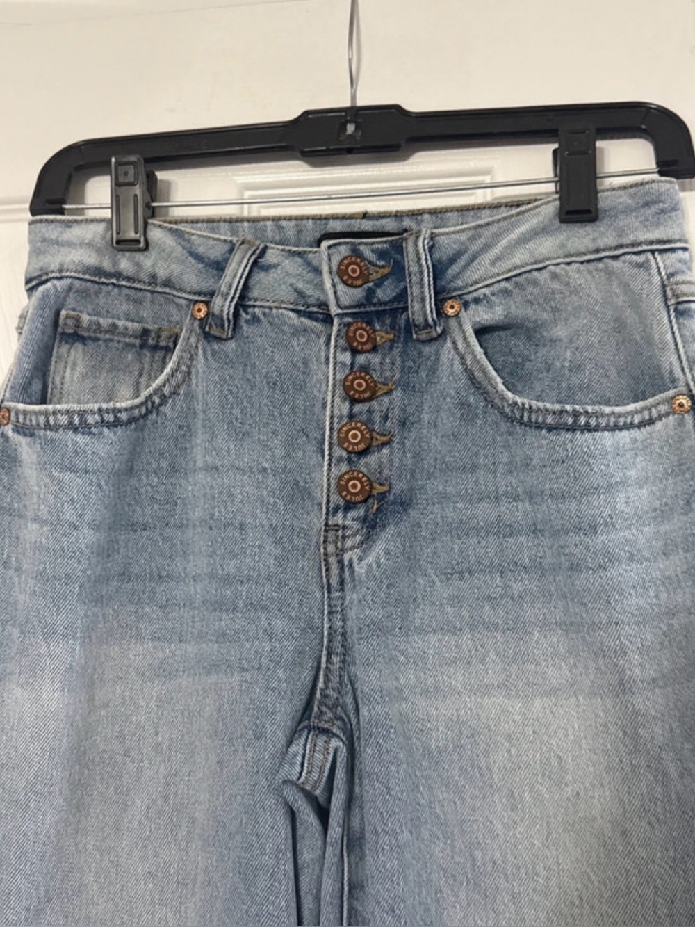 Sincerely Jules button-fly high-rise jeans in a light blue denim wash. Size US 1